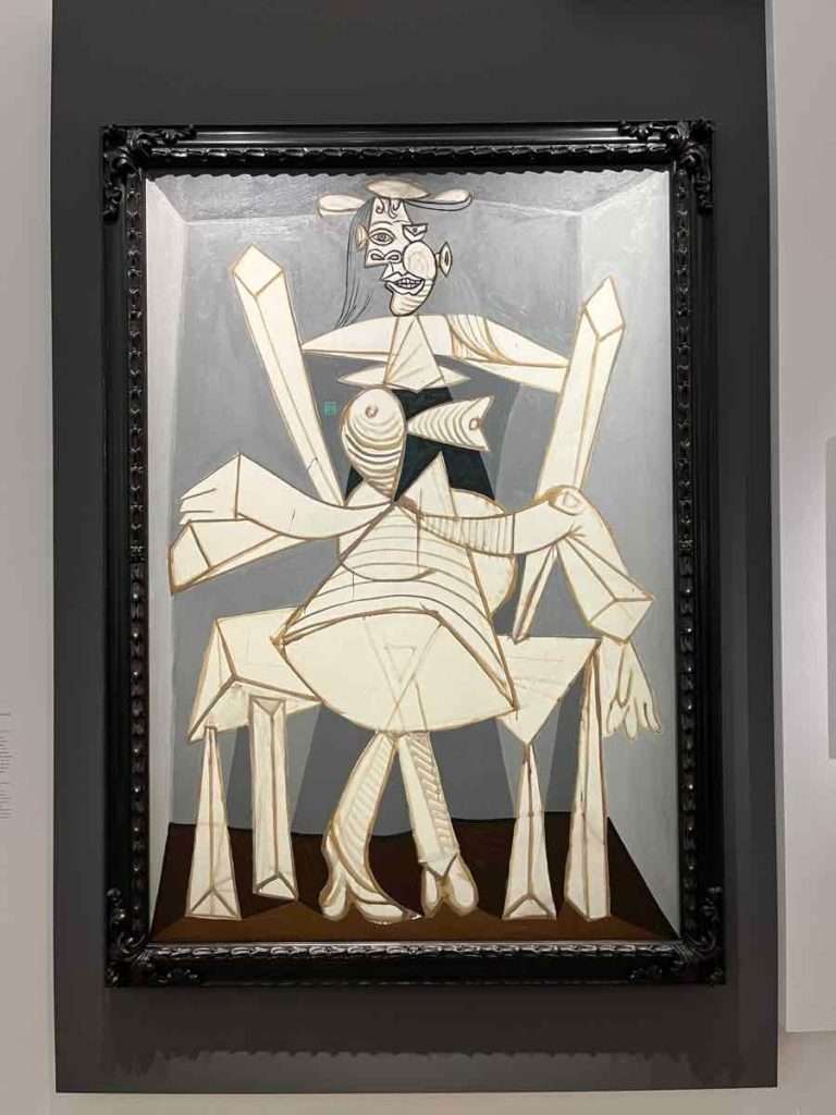 パブロ・ピカソの油絵、肘掛け椅子に座っている女